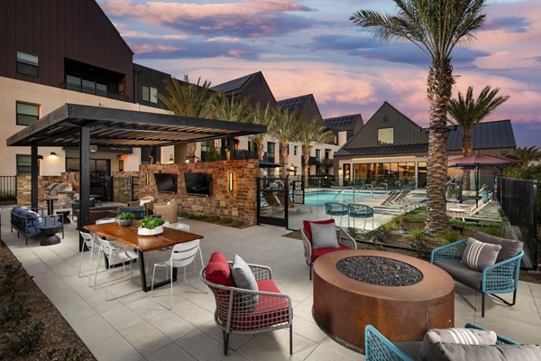 Fire pit lounge area with cozy seating at Silo Apartments, a luxury community by Greystar Perfect for outdoor gatherings and relaxation
