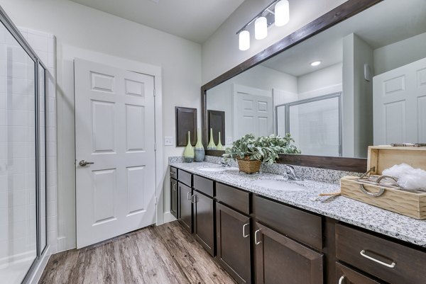 Bathroom featuring elegant marble countertops and modern fixtures at Ventura Ridge Apartments