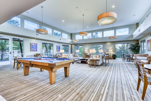 Game room with pool table and arcade games at Ventura Ridge Apartments