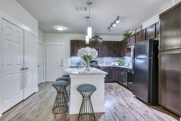 Modern kitchen with stainless steel appliances at Ventura Ridge Apartments