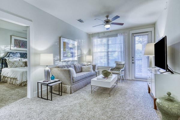 Living room with modern furnishings and natural light at Ventura Ridge Apartments