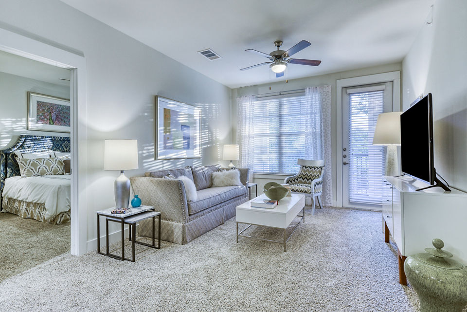 Living room with modern furnishings and natural light at Ventura Ridge Apartments