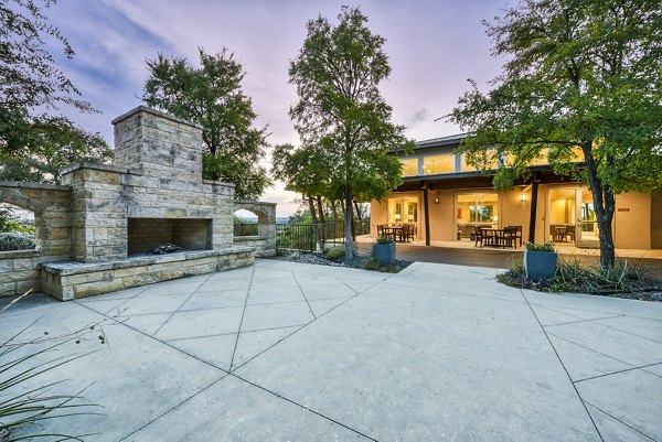 Fire pit area with seating at Ventura Ridge Apartments, perfect for outdoor gatherings in a tranquil setting