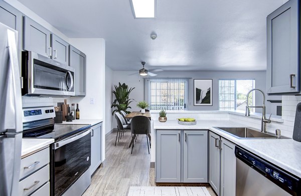 Modern kitchen featuring stainless steel appliances at Capitol Heights Apartments