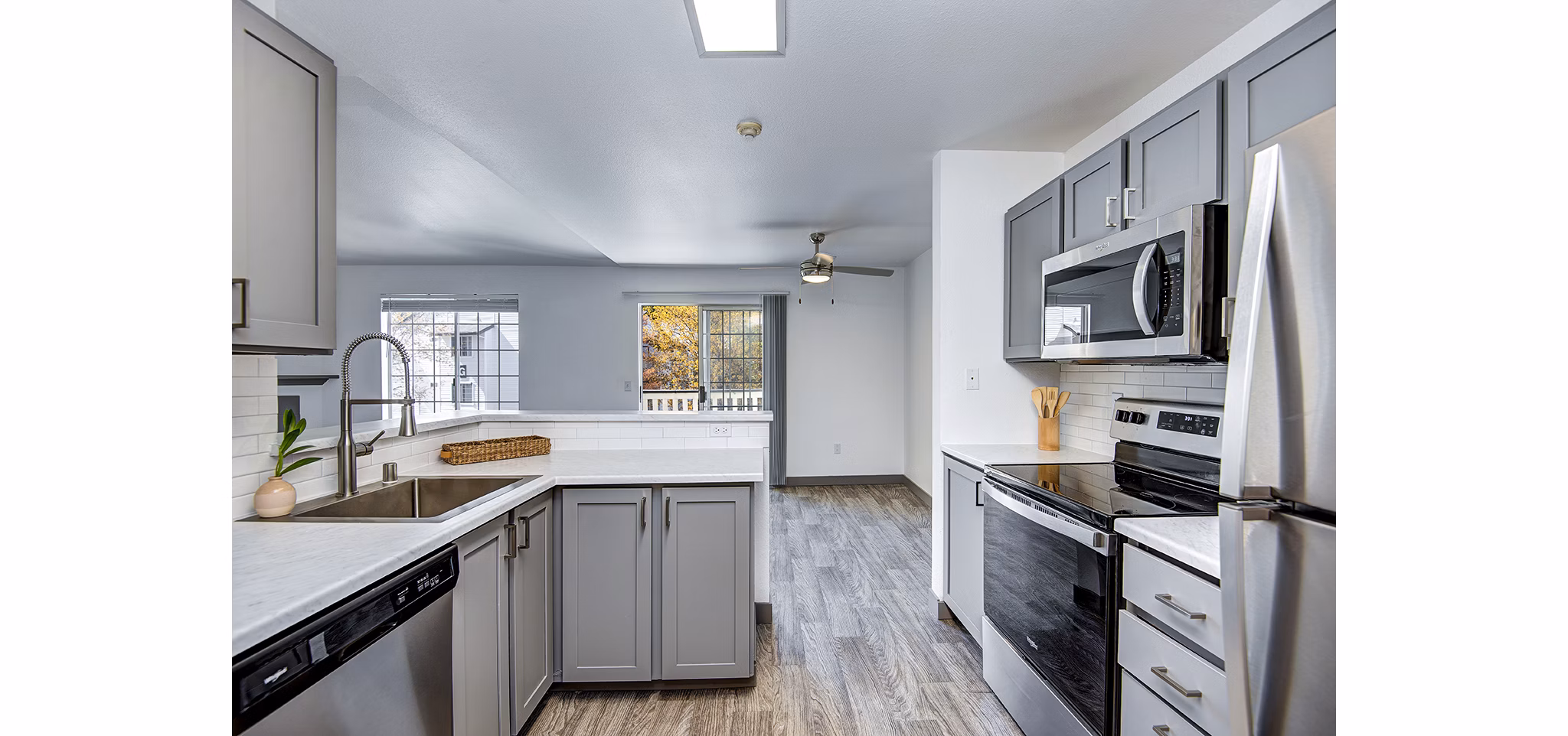 Contemporary kitchen with sleek countertops and modern appliances in Capitol Heights Apartments
