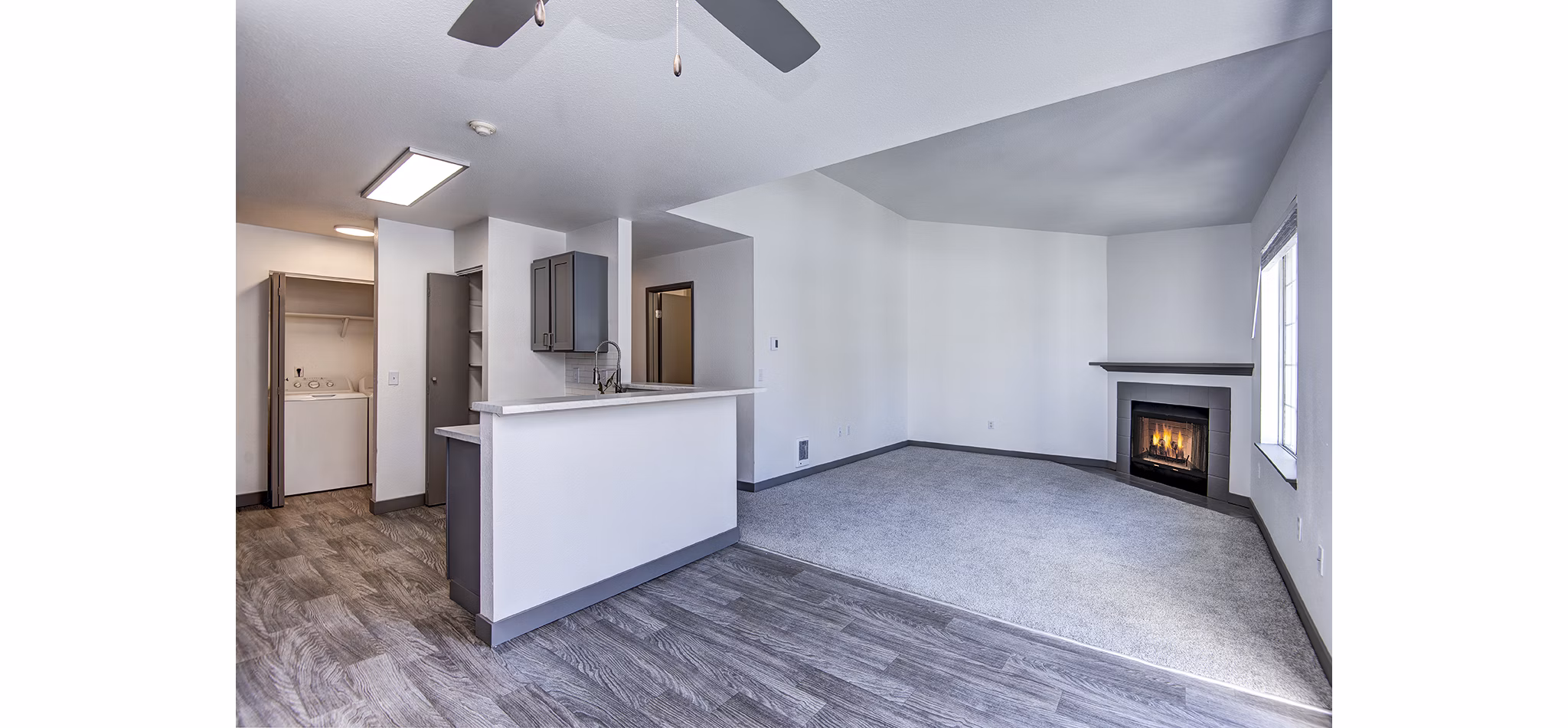 Living room with chic furnishings and natural light at Capitol Heights Apartments