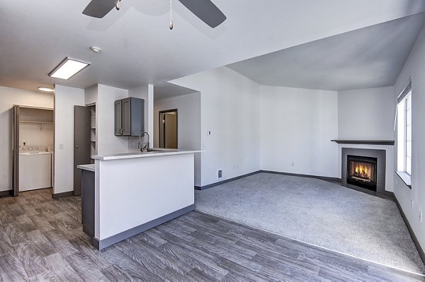Living room with chic furnishings and natural light at Capitol Heights Apartments