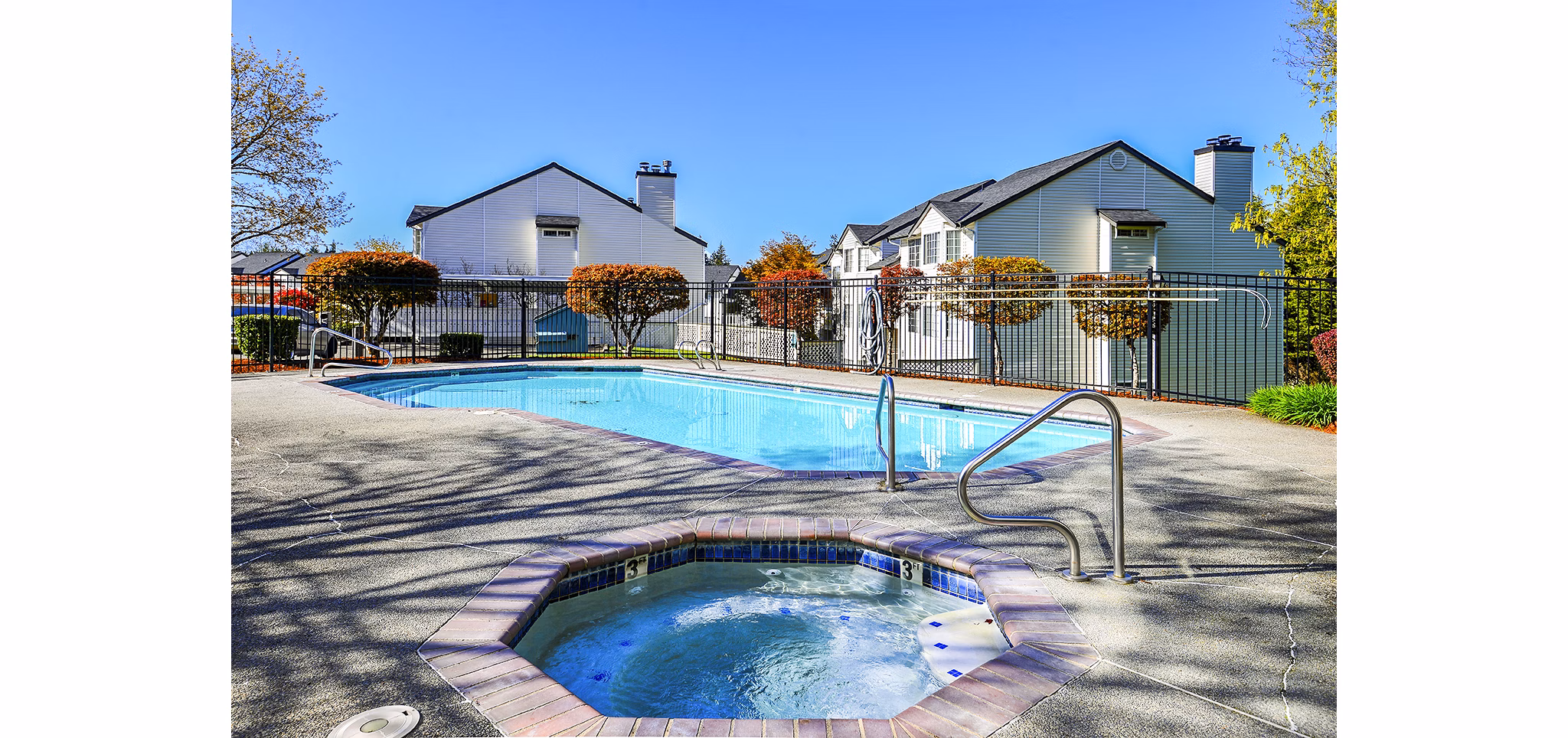 Luxurious pool with sun loungers at Capitol Heights Apartments, a Greystar community
