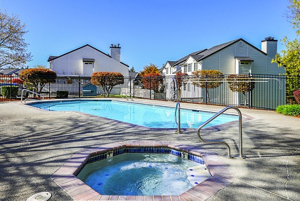 Luxurious pool with sun loungers at Capitol Heights Apartments, a Greystar community