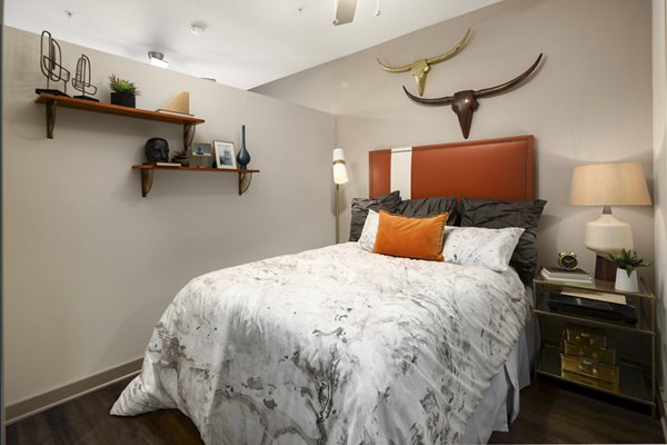 Cozy bedroom with modern decor at River House Apartments