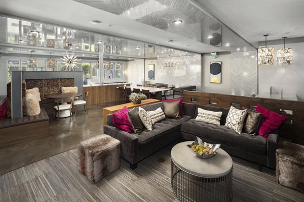 Modern clubhouse with comfortable seating at River House Apartments, perfect for social gatherings and leisure activities