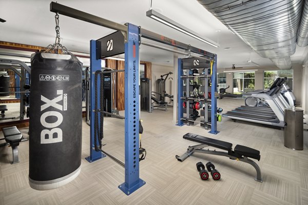 Modern fitness center with state-of-the-art equipment at River House Apartments for luxury living