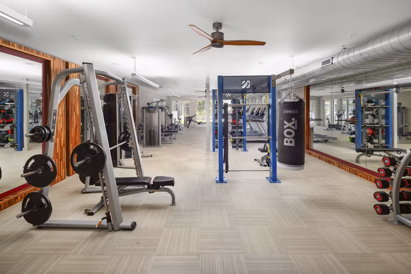 State-of-the-art fitness center with modern equipment at River House Apartments