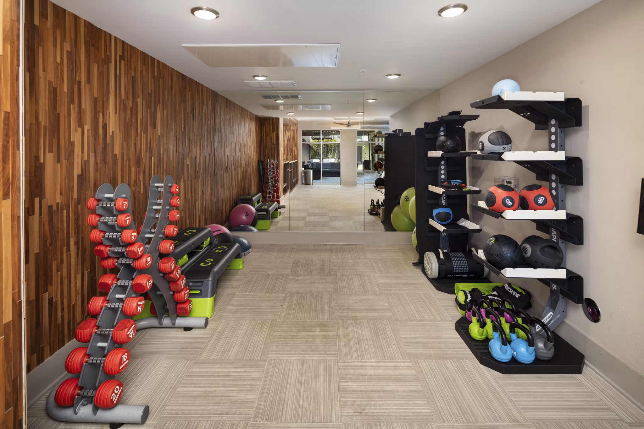 Modern fitness center with state-of-the-art equipment at River House Apartments, perfect for athletic training and active living