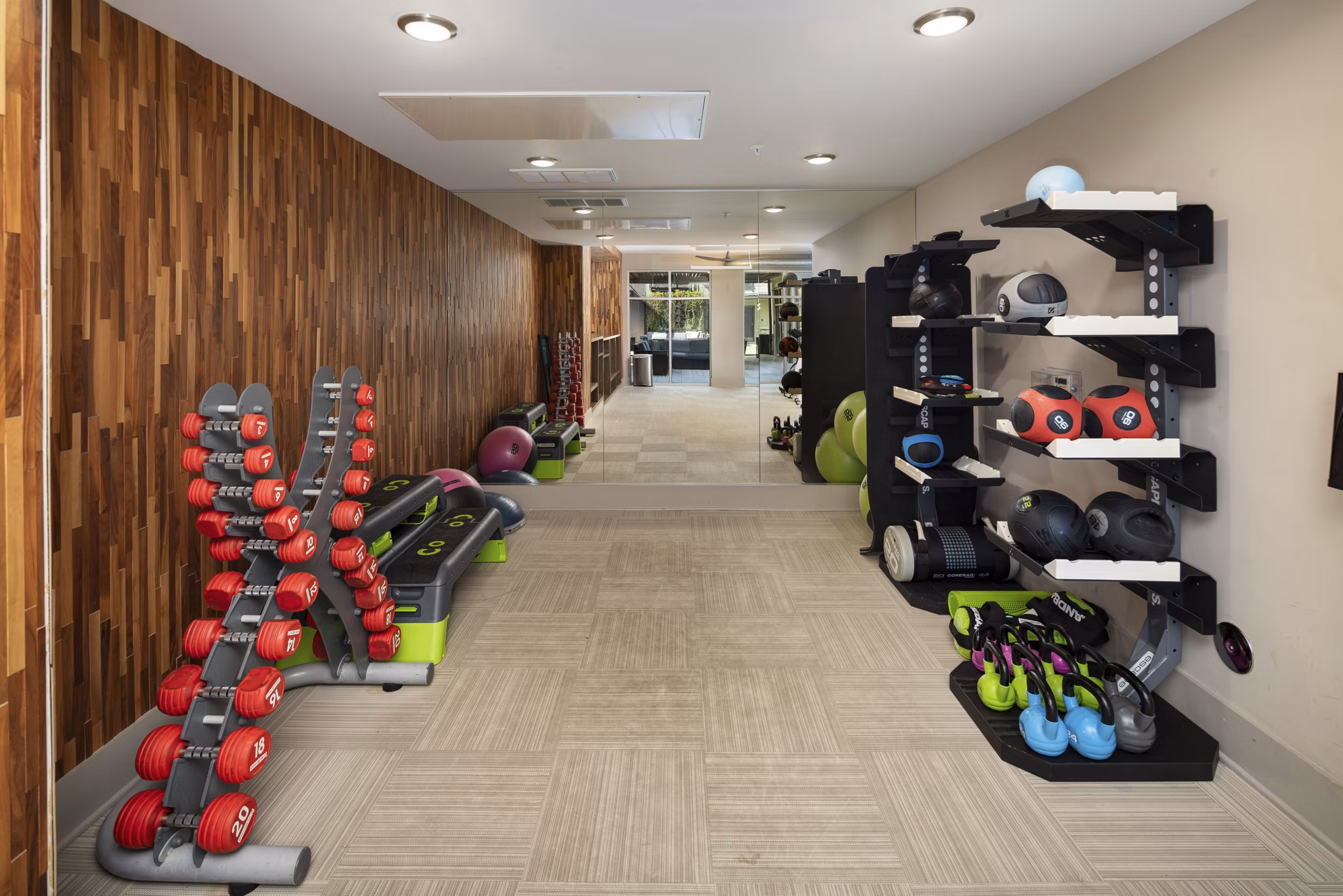 Modern fitness center with state-of-the-art equipment at River House Apartments, perfect for athletic training and active living