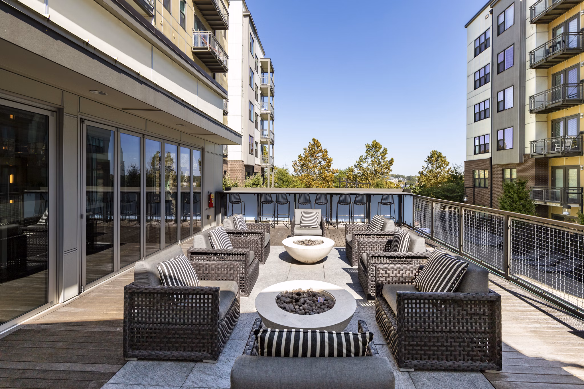 Cozy fire pit area at River House Apartments, luxury living by Greystar