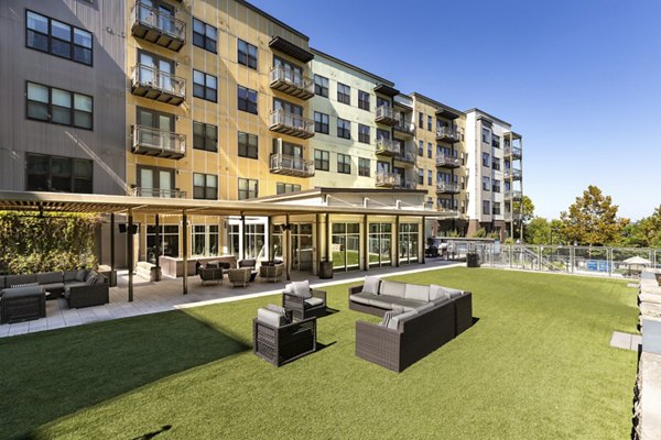 Serene courtyard with lush greenery at River House Apartments