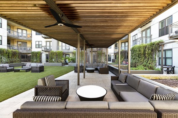 Modern courtyard with landscaped gardens at River House Apartments in luxury residential complex