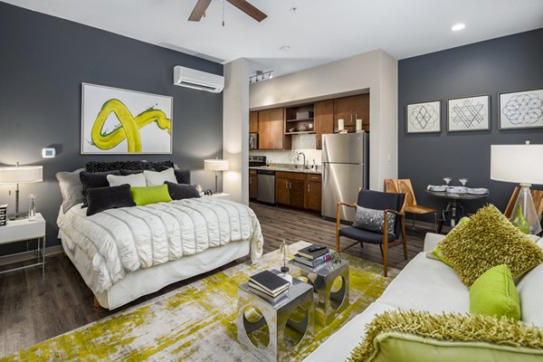 Modern studio bedroom with sleek furnishings at Terra House Apartments in luxury living community