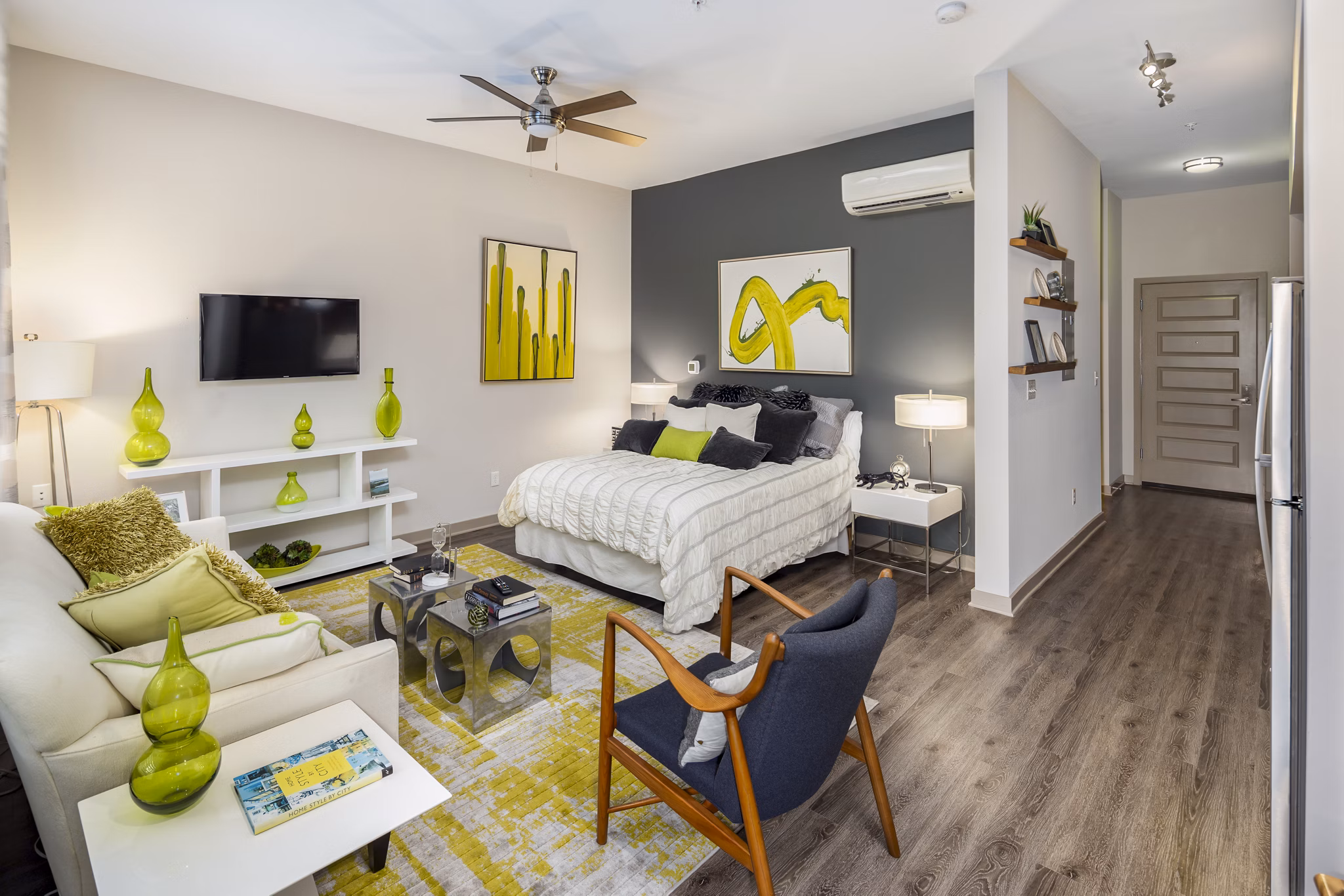 Studio bedroom with modern decor and city views at Terra House Apartments