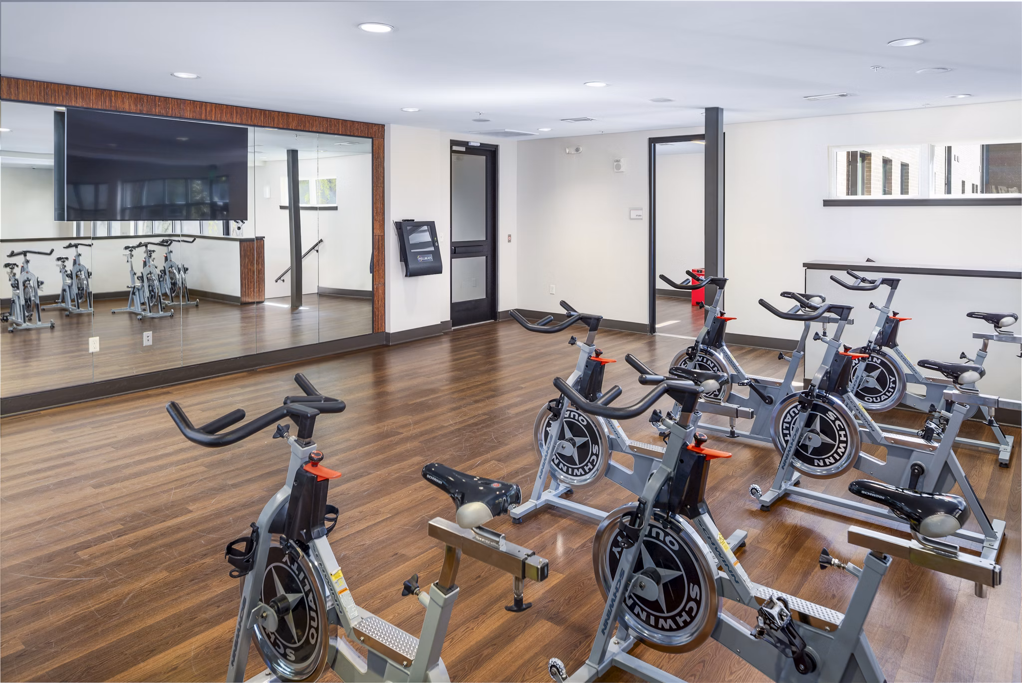 Yoga and spin studio with modern equipment at Terra House Apartments for fitness enthusiasts