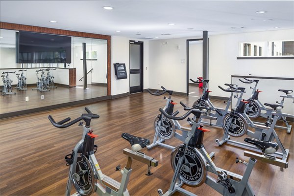 Yoga and spin studio with modern equipment at Terra House Apartments for fitness enthusiasts