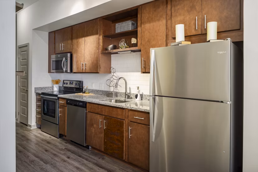 Modern kitchen with stainless steel appliances at Terra House Apartments luxury rentals