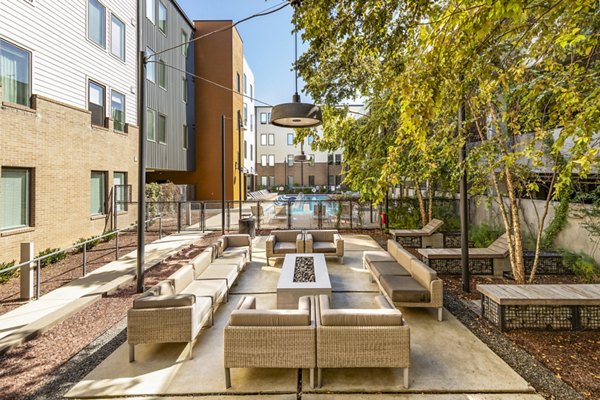 Cozy outdoor fire pit on patio at Terra House Apartments offers luxury social space in urban setting