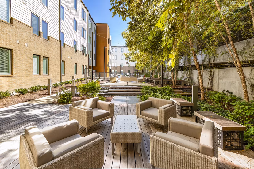 Cozy outdoor patio with modern fire pit at Terra House Apartments perfect for entertaining guests