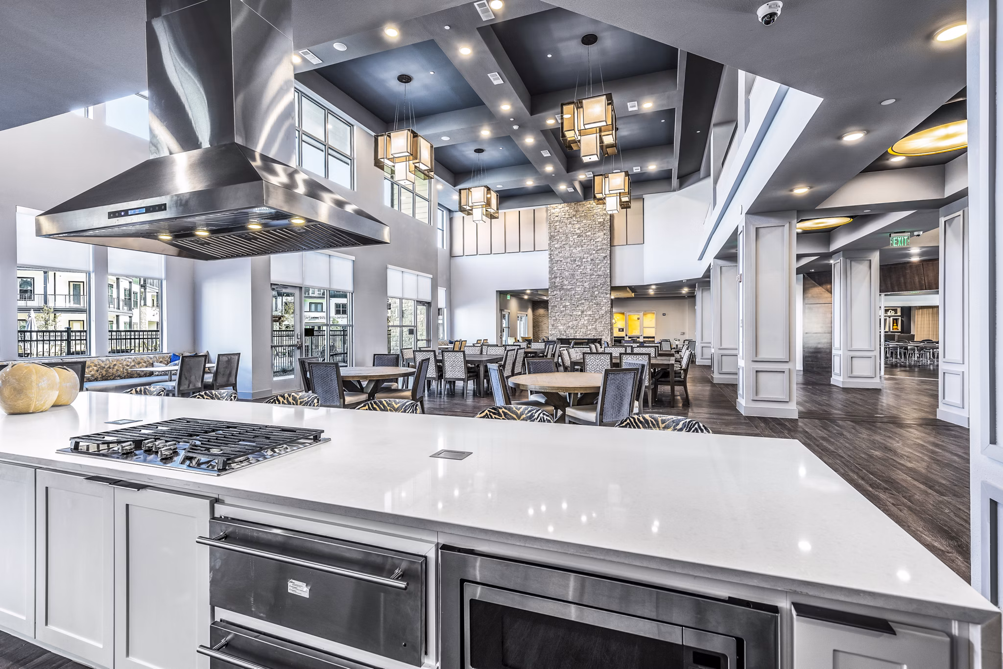 Clubhouse kitchen with modern appliances at Larkspur at Creekside Apartments, featuring sleek countertops and ample storage options for residents