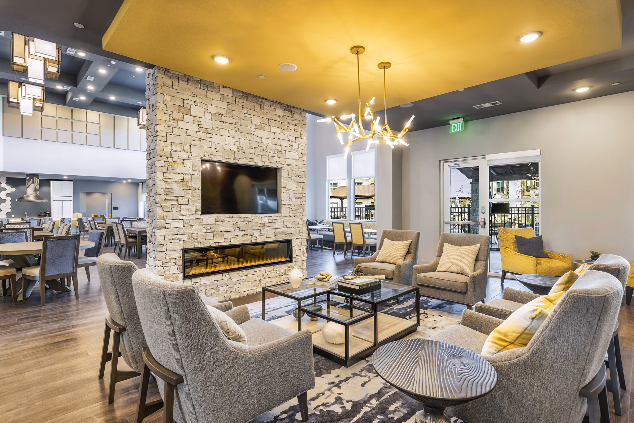 Modern clubhouse with stylish seating and vibrant decor at Larkspur at Creekside Apartments