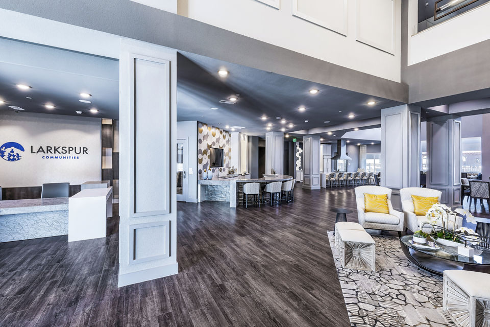 Clubhouse with modern decor and cozy seating at Larkspur at Creekside Apartments