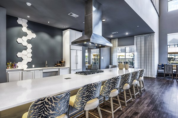 Modern clubhouse kitchen featuring stainless steel appliances at Larkspur at Creekside Apartments