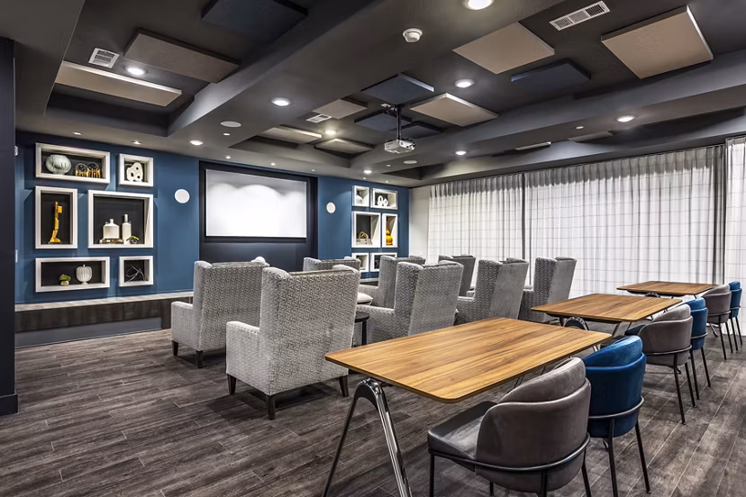 Clubhouse theater with luxury seating and large screen at Larkspur at Creekside Apartments