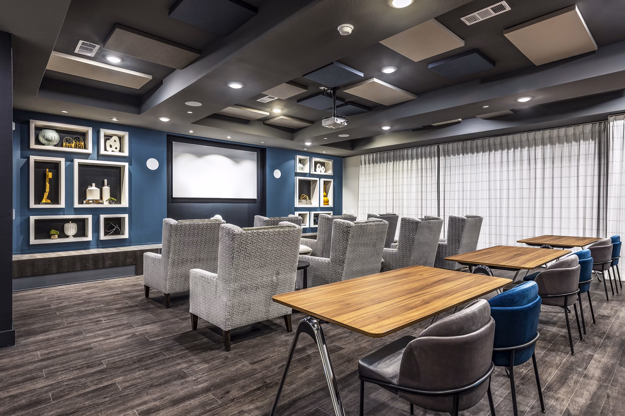 Clubhouse theater with luxury seating and large screen at Larkspur at Creekside Apartments