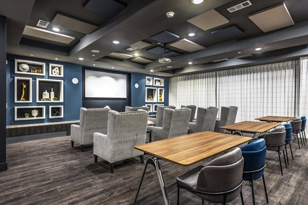 Clubhouse theater with luxury seating and large screen at Larkspur at Creekside Apartments