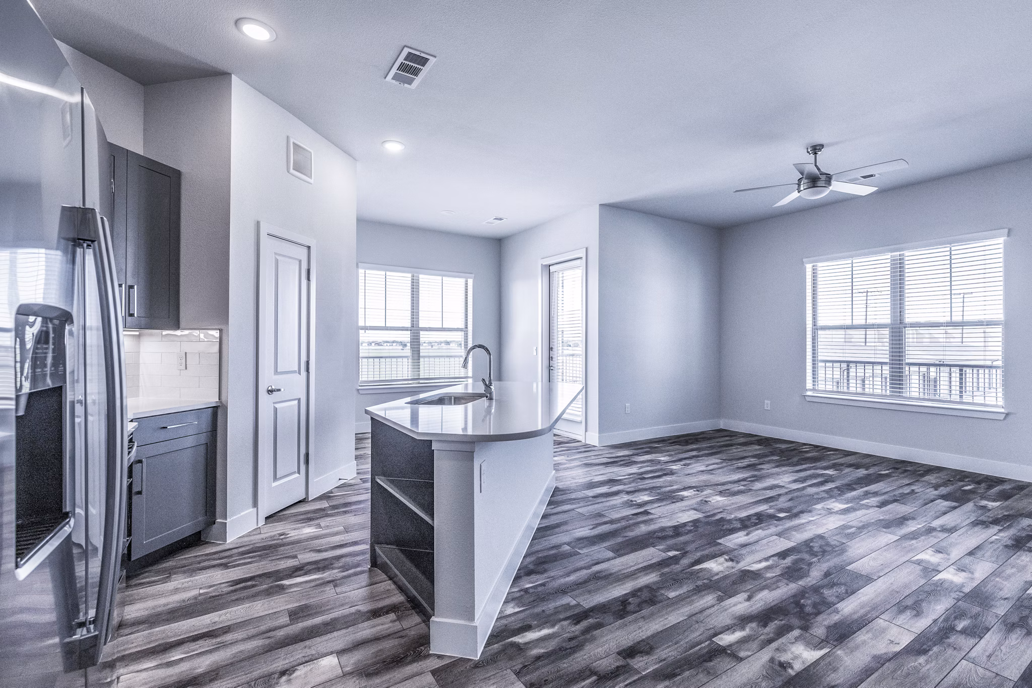 Larkspur at Creekside Apartments: Modern kitchen with stainless steel appliances and granite countertops