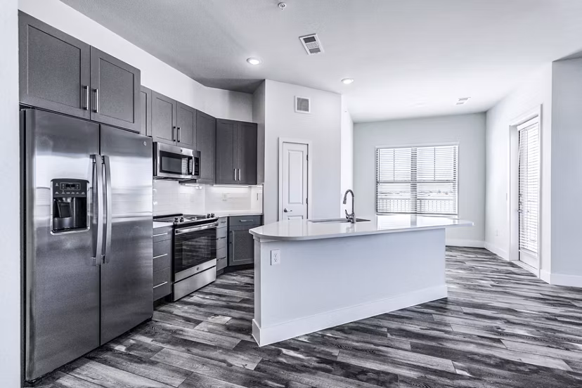 Modern kitchen with stainless steel appliances at Larkspur at Creekside Apartments