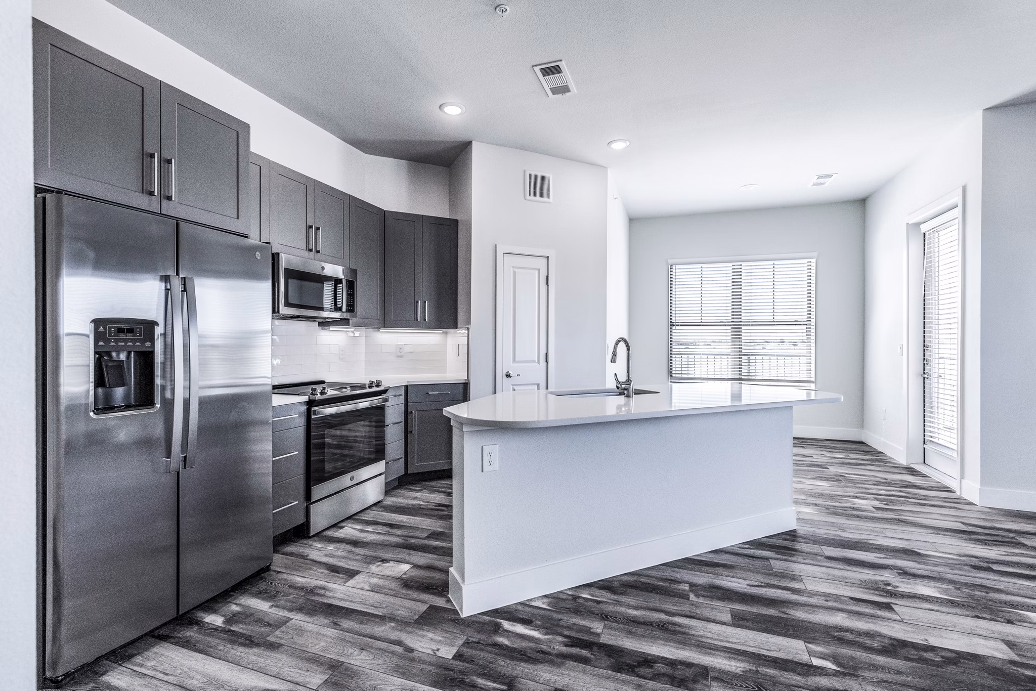 Modern kitchen with stainless steel appliances at Larkspur at Creekside Apartments