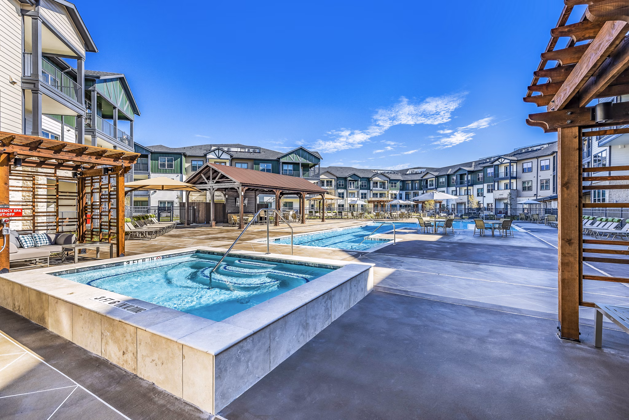 Relaxing hot tub experience at Larkspur at Creekside Apartments, perfect for unwinding in a serene setting