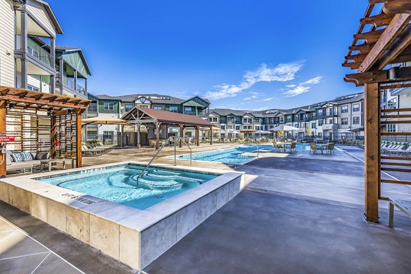 Relaxing hot tub experience at Larkspur at Creekside Apartments, perfect for unwinding in a serene setting