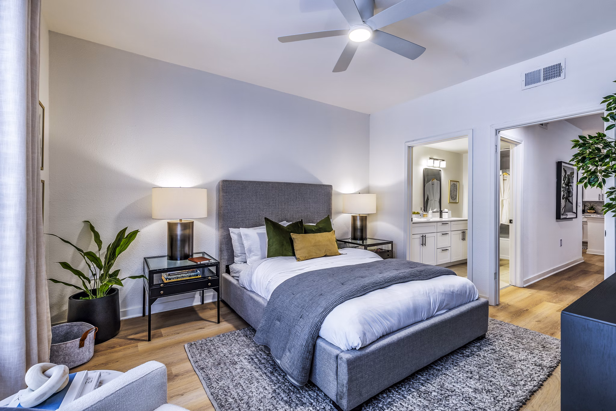 Bedroom featuring modern decor and plush bedding at The Lola Apartments