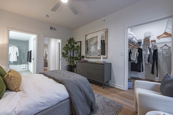 Bedroom with sleek design and modern decor at The Lola Apartments