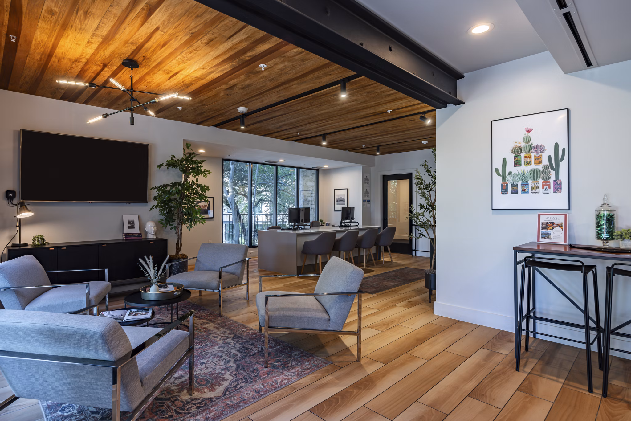The Lola Apartments: Stylish clubhouse featuring modern decor and amenities in a luxury apartment community