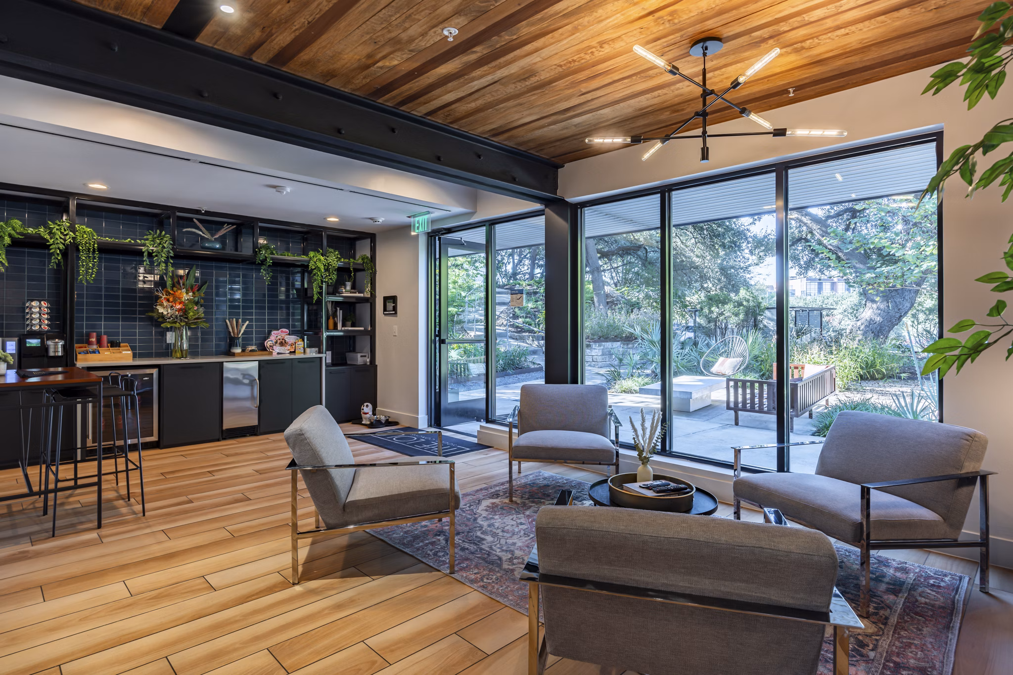 Clubhouse with modern decor and lounge seating at The Lola Apartments, a luxury property managed by Greystar