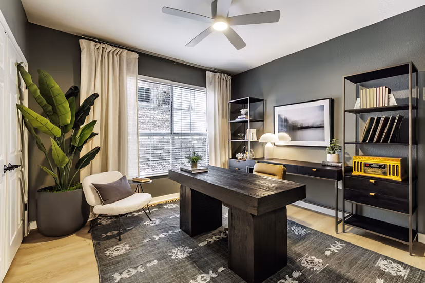 Modern home office with ergonomic desk and chair in The Lola Apartments, ideal for remote work in a luxury living environment