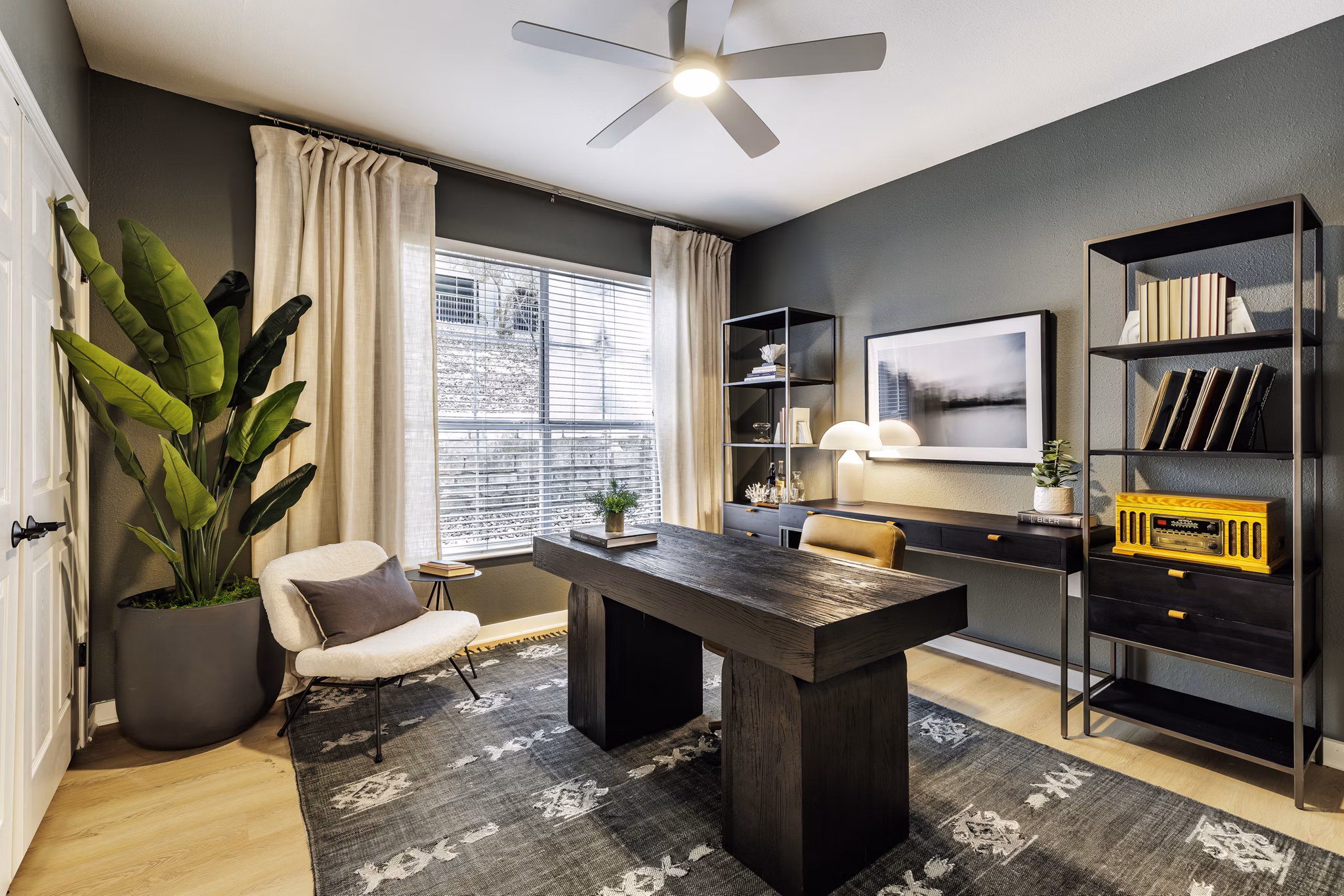 Modern home office with ergonomic desk and chair in The Lola Apartments, ideal for remote work in a luxury living environment