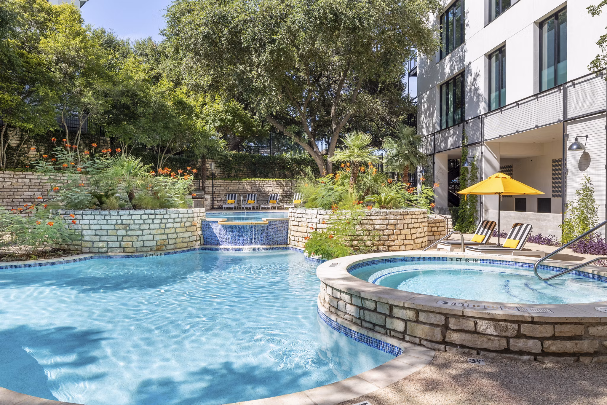 The Lola Apartments: Outdoor pool with lounge seating