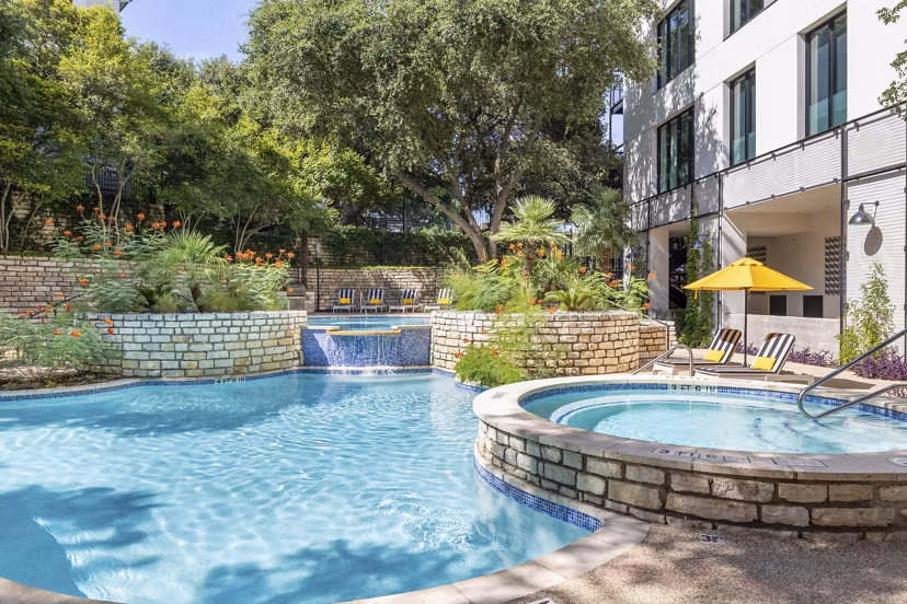 The Lola Apartments: Outdoor pool with lounge seating