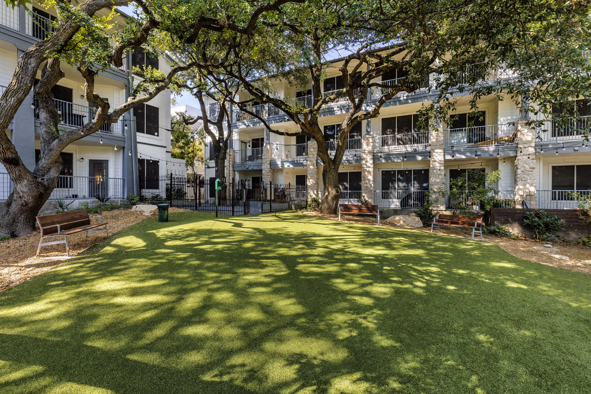 Modern dog park with agility equipment at The Lola Apartments for pet-friendly living